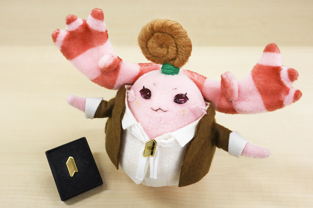 Monolith Soft Shares Photo of Monopon Wearing the Company Emblem